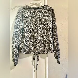 CURE women’s long sleeve Leopard Print Top with drawstring hem.